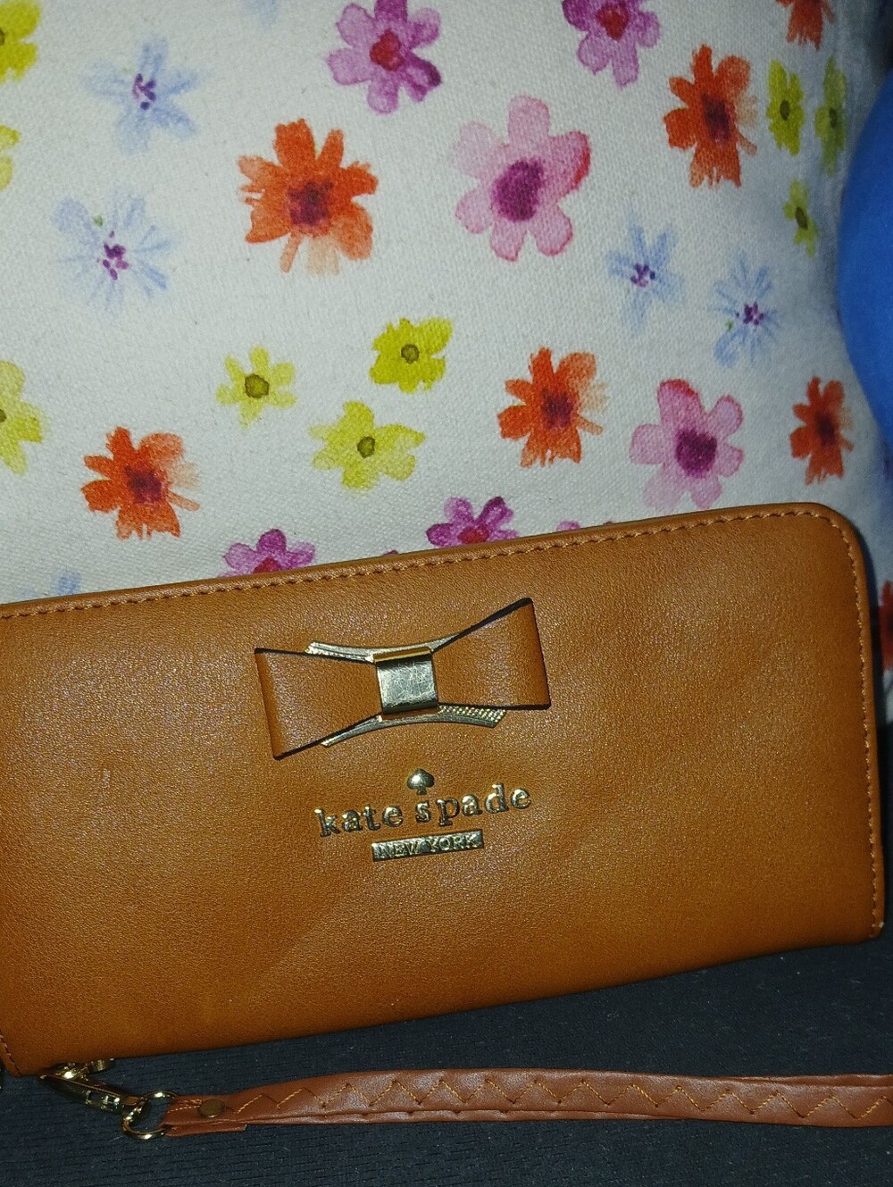 kate spade tan bow wristlet clutch with gold-tone logo